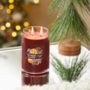 holiday zest signature large jar candle on table image number 4