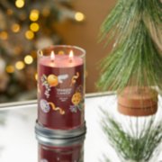 holiday zest signature large tumbler candle on table image number 4