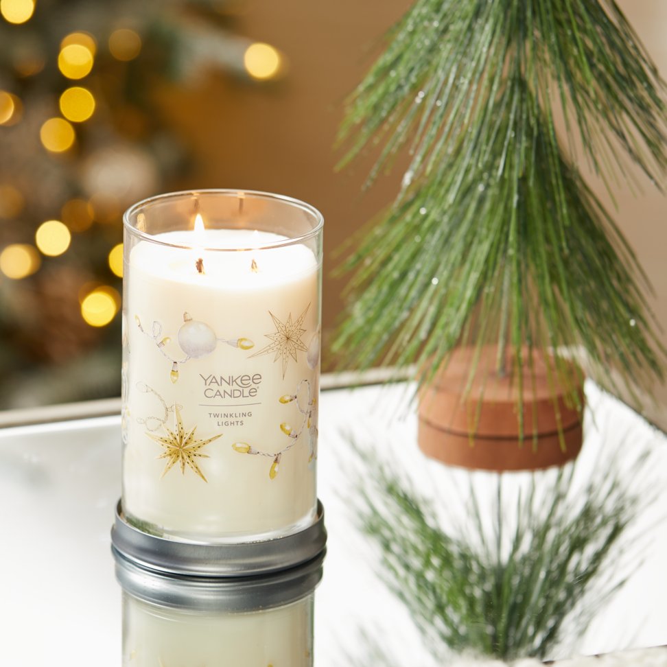 twinkling lights signature large tumbler candle on table