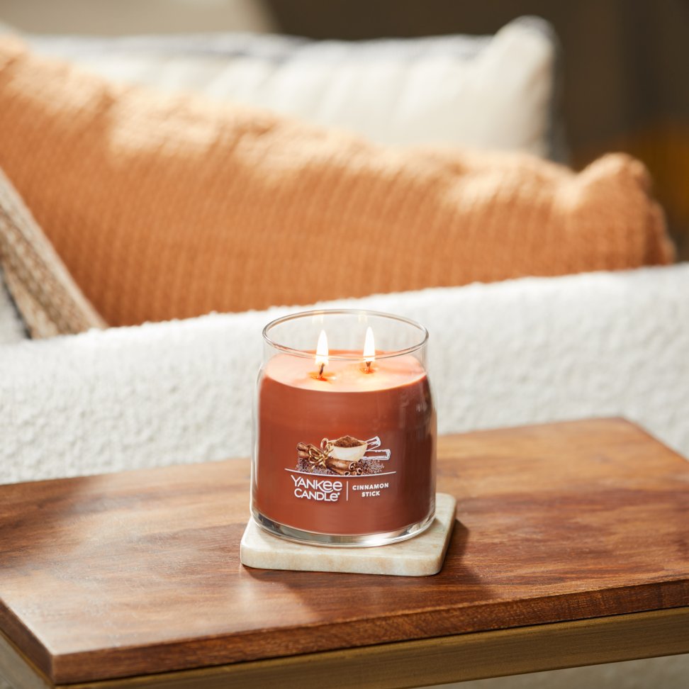 cinnamon stick signature medium jar candle on table