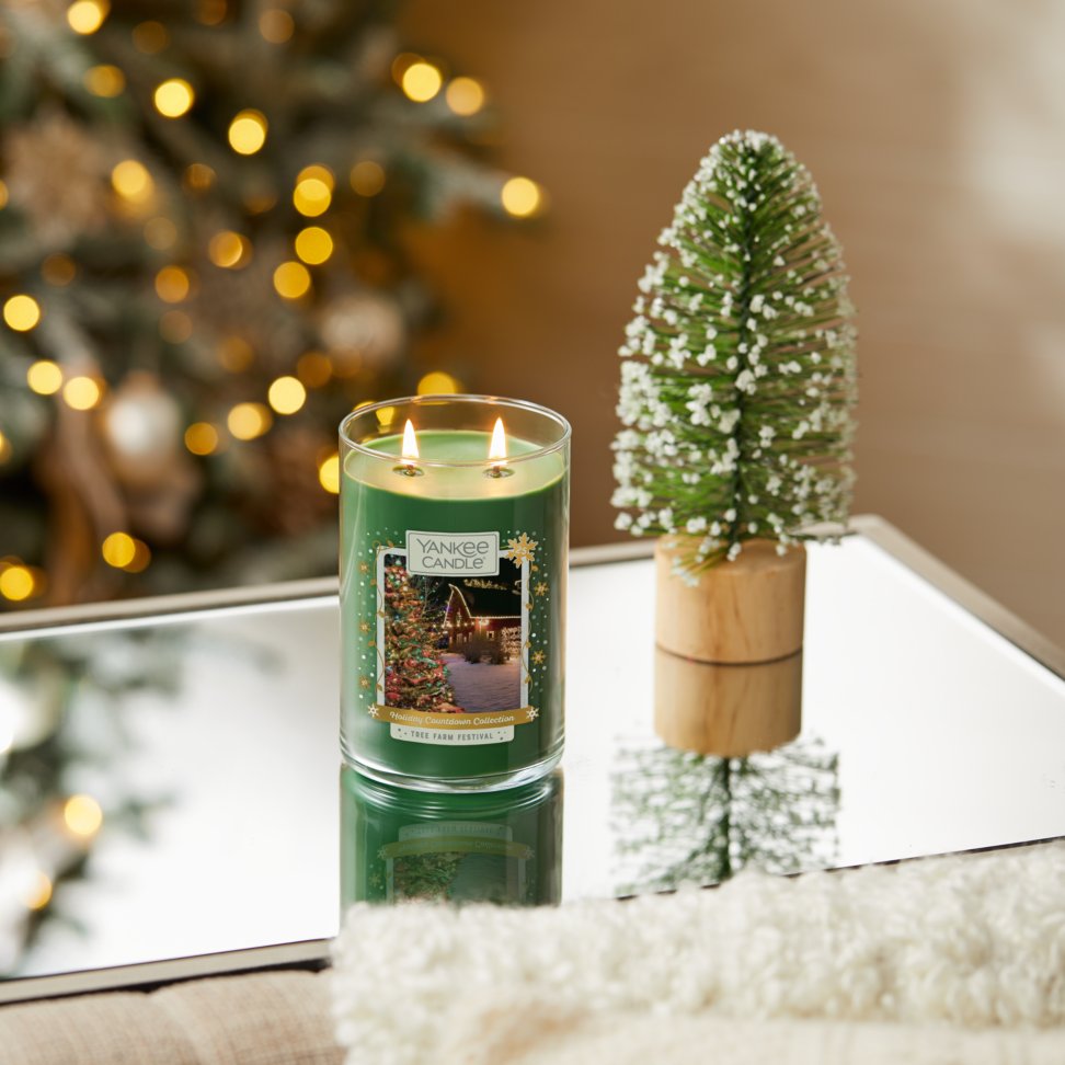tree farm festival large two wick tumbler candle on table
