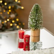 two red apple wreath samplers votive candles, one on table and one in votive candle holder on table image number 3
