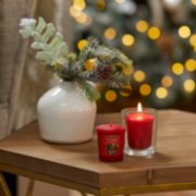 two red apple wreath samplers votive candles, one on table and one in votive candle holder on table image number 3