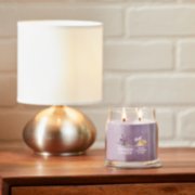 dried lavender and oak signature medium jar candle on table image number 6