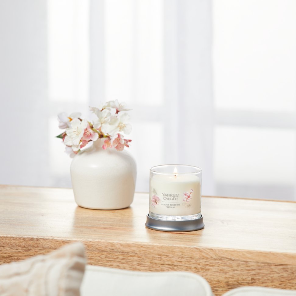 sakura blossom festival signature small tumbler candle on table
