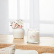 sakura blossom festival signature medium jar candle on table image number 4