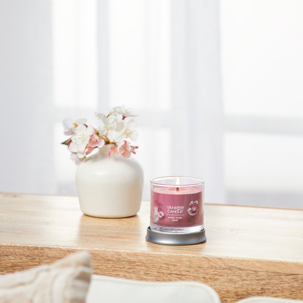 sweet plum sake signature small tumbler candle on table