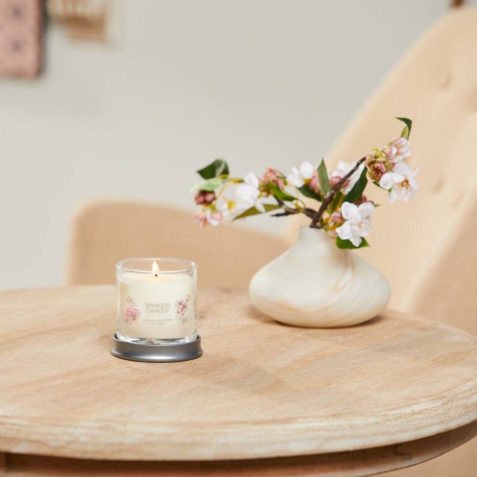 sakura blossom festival signature small tumbler candle on table