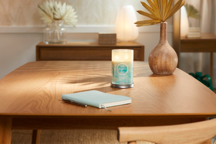 inspire signature large tumbler candle on wooden table