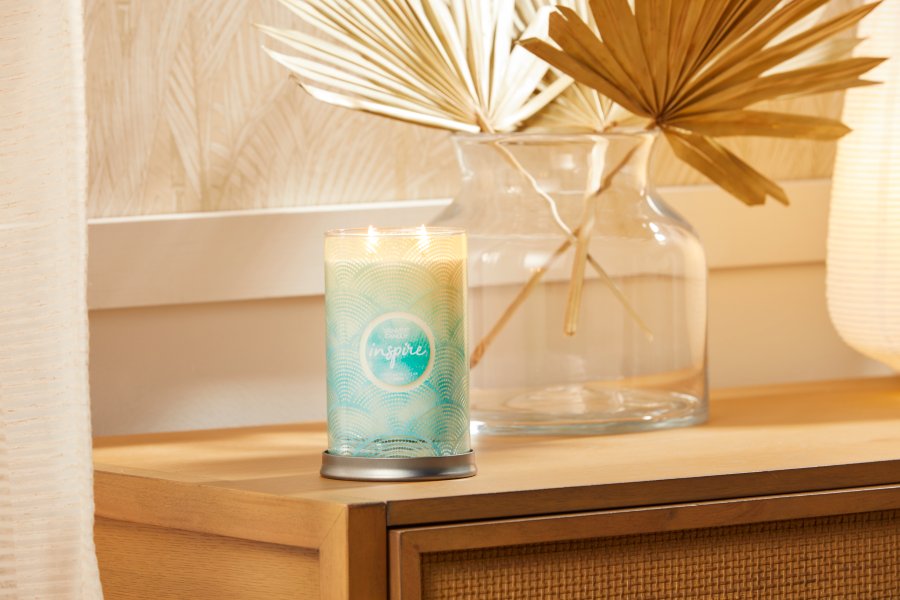 inspire scent of the year signature large tumbler candle on table