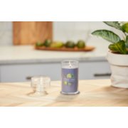 lit black tea and lemon signature medium pillar candle on wooden counter image number 4