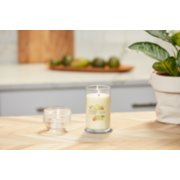 lit iced berry lemonade signature medium pillar candle on wooden counter image number 4