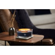 woodwick indigo suede ellipse candle on table in living room image number 4