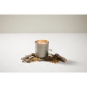 chesapeake bay candle intentions collection be curious black birch cedar medium two wick jar candle surrounded by sticks on a table image number 6