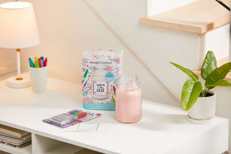 a create your own one-of-a-kind personalized photo label gift set next to a pink-colored original large jar candle and a pack of cosmic colored sharpies on a white table