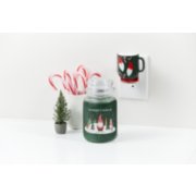 gnome balsam and cedar large jar candle with holiday gnome scentplug diffuser and white vase of candy canes image number 5