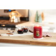 holiday cheer original large jar candle in kitchen scene with mulled wine and cinnamon sticks image number 5