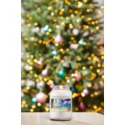 balsam and cedar original large jar candle on a table with a decorated christmas tree in the background image number 2