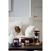 three woodwick black cherry candles in various sizes on living room table image number 3