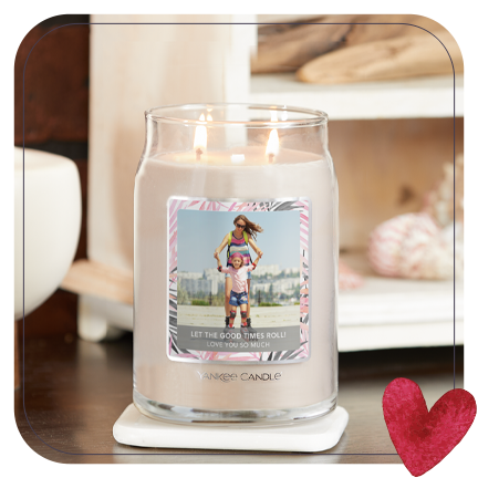 a signature large jar candle with a mother and daughter personalized photo label on a white coaster