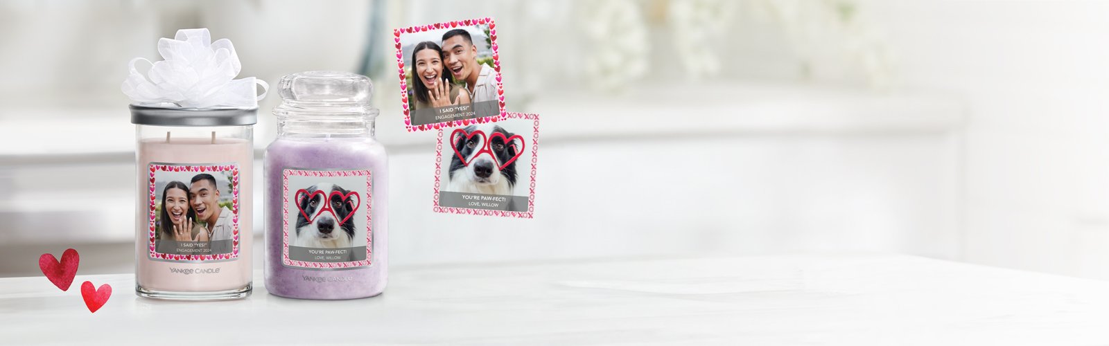 a signature large tumbler candle and an original large jar candle with personalized photo labels on a table