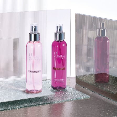 Two pink-coloured room spray bottles