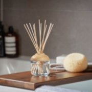 reed diffusers on wooden pad image number 2