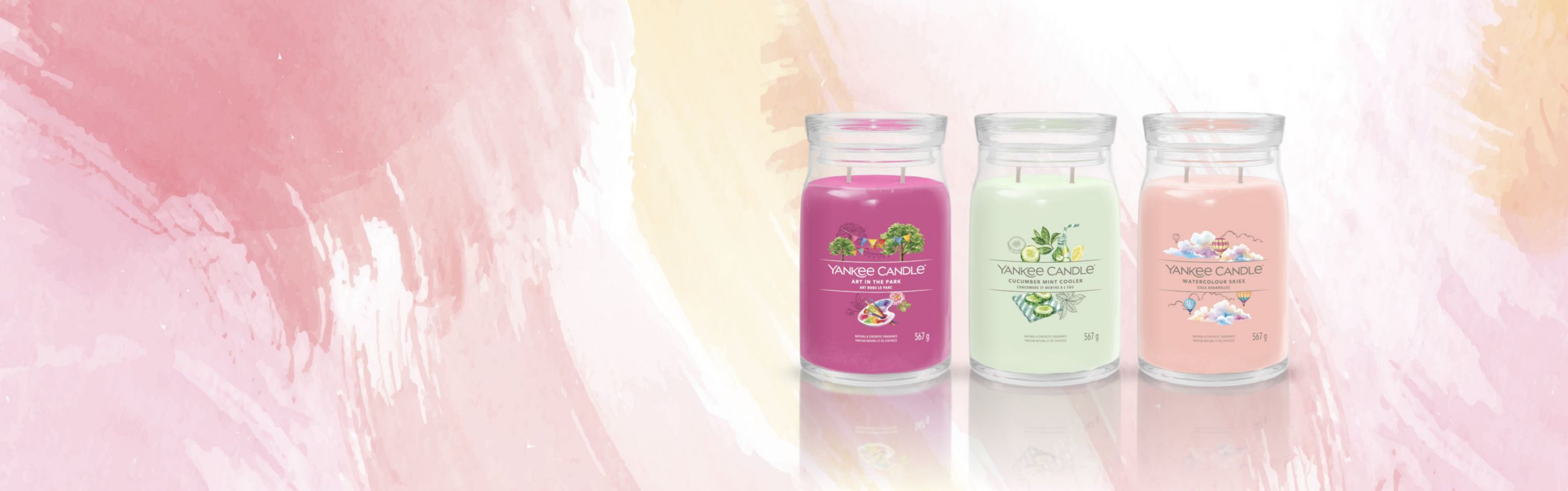yankee candle lineup including two wick fuchsia, light green, and light pink scented candles